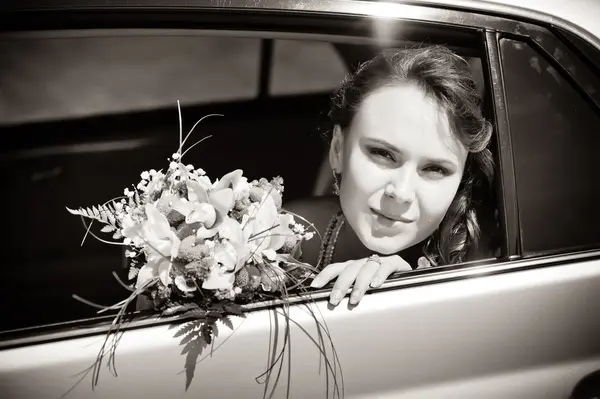 Bride in the car Royalty Free Stock Photos