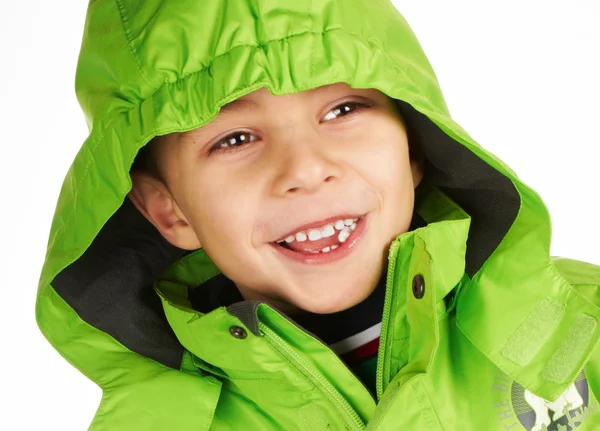 Laughing boy dressed in a warm winter jacket — Stock Photo, Image