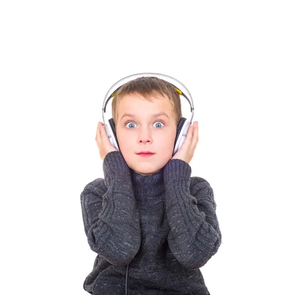 Close up portrait of surprised boy listening to music with headp — Stock Photo, Image