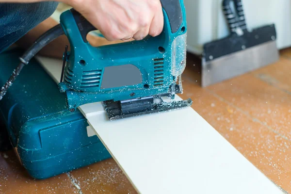 Close-up process of cutting panel with jigsaw — Stock Photo, Image