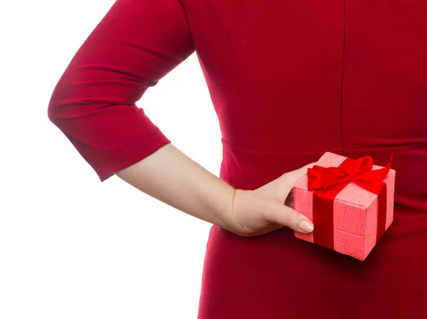 Woman hiding gift behind her back. Concept of holiday — Stock Photo, Image