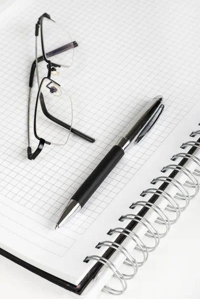 Pen and spiral notebook — Stock Photo, Image