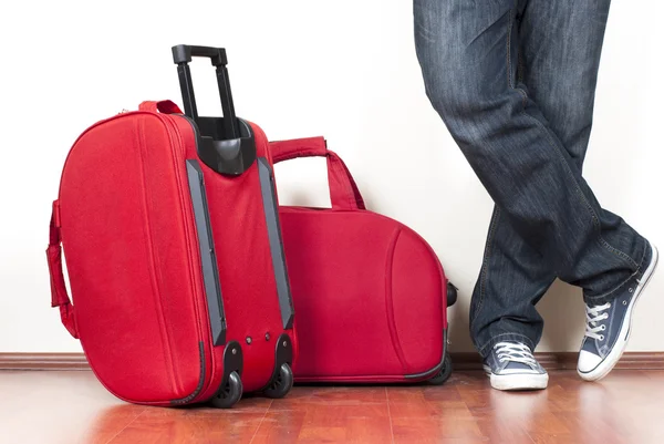 Red Suitcases and the man — Stock Photo, Image