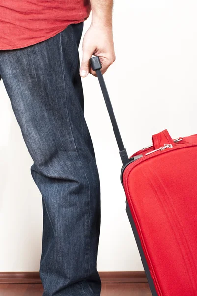 Man with red suitcases — Stock Photo, Image
