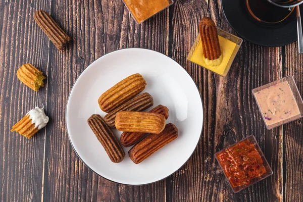 Churros Curry Olives Tomato Paste Wooden Table Turkish Tea — стоковое фото