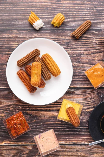 Churros Curry Olives Tomato Paste Wooden Table Turkish Tea — стоковое фото