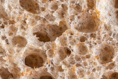 Buğday unundan pişirilmiş kahverengi ekmek dokusu. Yüksek çözünürlüklü kahverengi ekmek dokusu arka planı.