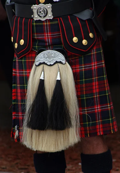 Man in a red and black kilt — Stock Photo, Image