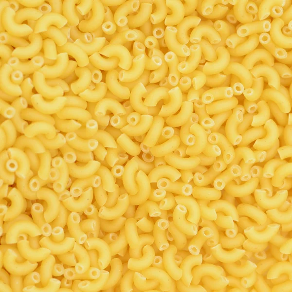Bakgrundsstruktur av pasta snäckor fyrkant Stockbild