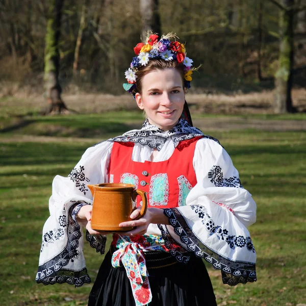 The smiling girl in folk costume — Stock Photo, Image