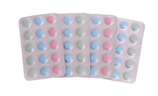 Пакеты с цветными таблетками — стоковое фото