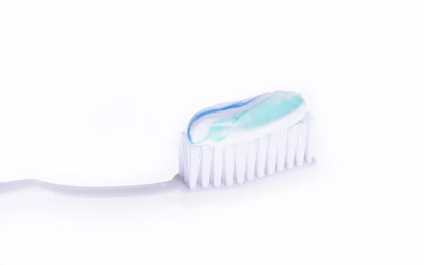 A toothbrush with the paste — Stock Photo, Image