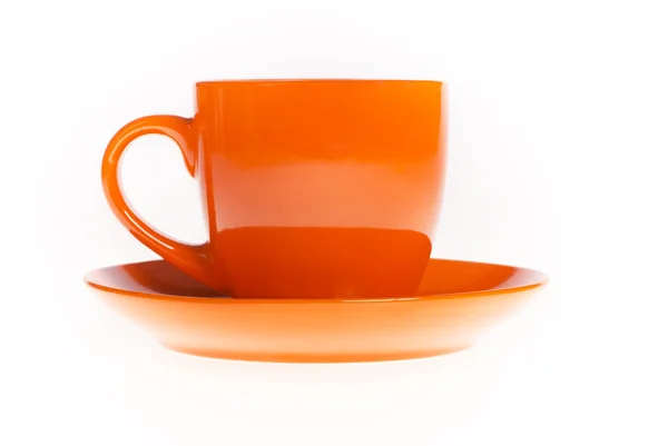 Oranžové čaj hrnek s podšálkem — Stock fotografie
