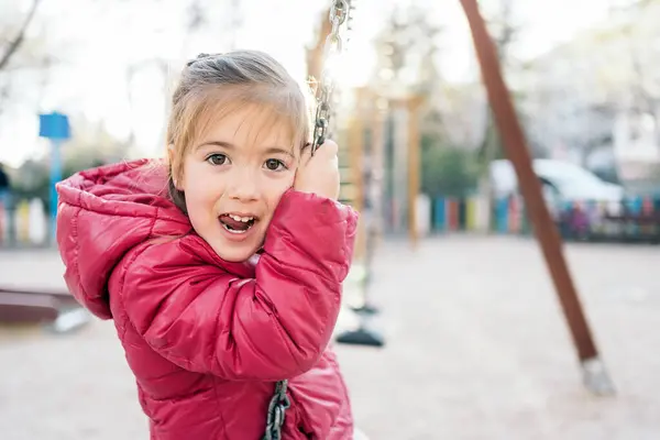 School Age Girl Smiling Joyfully While Riding Swings Park — Stock Photo, Image