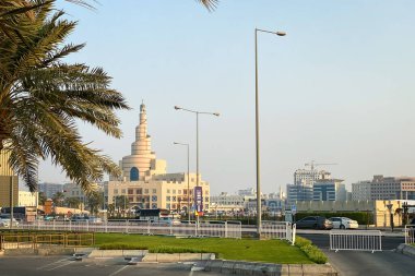 Cityscape old town of Doha, Qatar with Al Fanal building and Qatar Islamic Cultural Center against blue sky