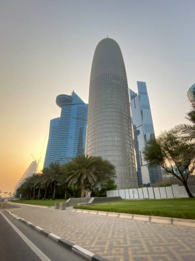 Doha, Qatar  October 3, 2019: Low angle view of Burj Doha Tower against blue sky at sunset.