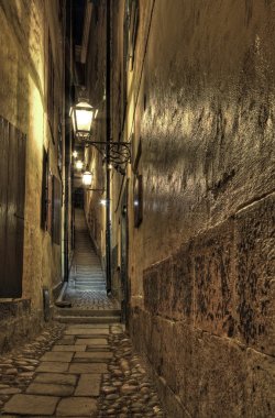 Old Town alley with lanterns at night. clipart