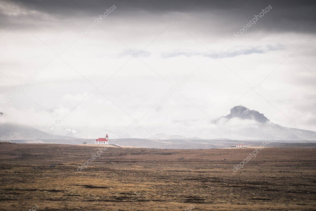 alone church over fog in west iceland