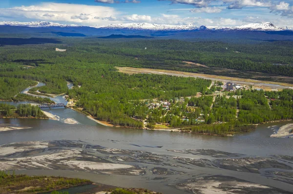 Aerial view of the town of Talkeetna, Alaska with rivers and moutnains