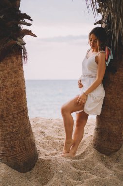 Beautiful and natural woman enjoying nature on a summer day.