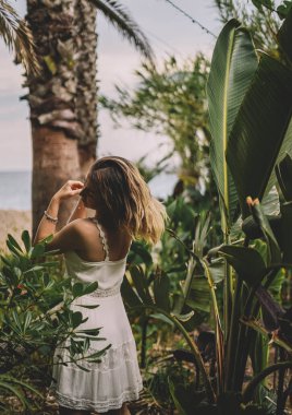 Beautiful and natural woman enjoying nature on a summer day.