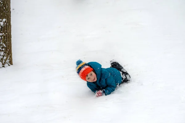Little Boy Laughing Rolling Field Snow — Stok fotoğraf