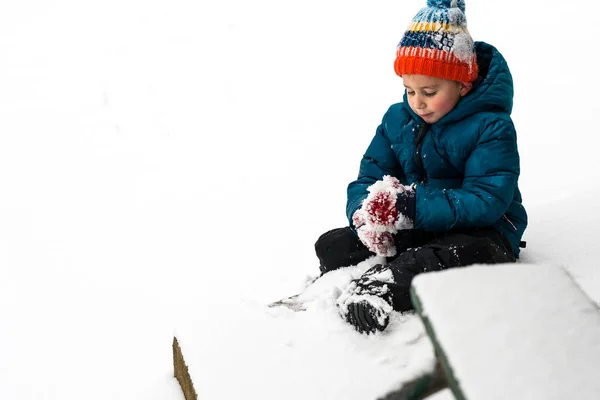 Rosy Cheeked Boy Making Snowball — Fotografia de Stock