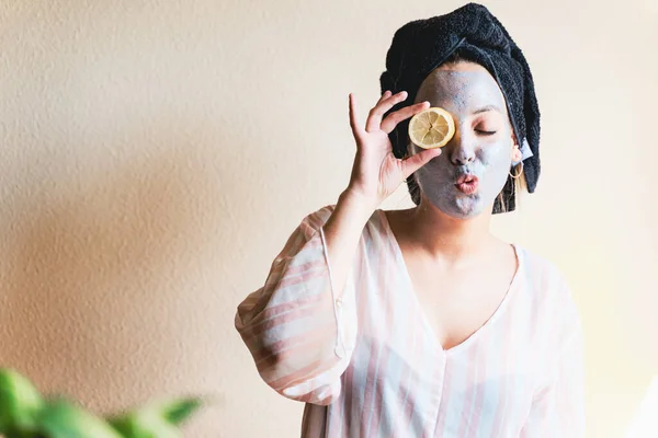 Happy Girl Applying Facial Cleansing Mask While — Stok Foto