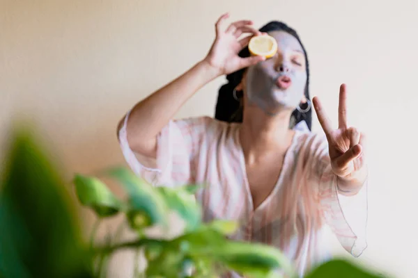 Happy Girl Applying Facial Cleansing Mask While — Stock fotografie