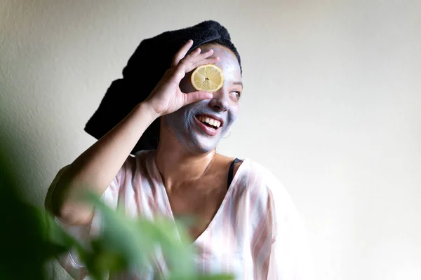 Happy Girl Applying Facial Cleansing Mask While — Stok Foto