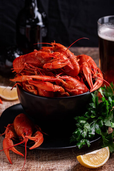 boiled crayfish with beer on a wooden background