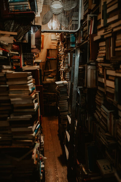 Books stacked from floor to ceiling in New Orleans bookstore