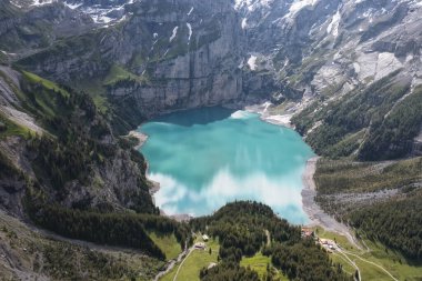 Blue lagoon in high mountain from aerial view