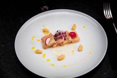 Pork feet tataki with radish and spices just served to the table