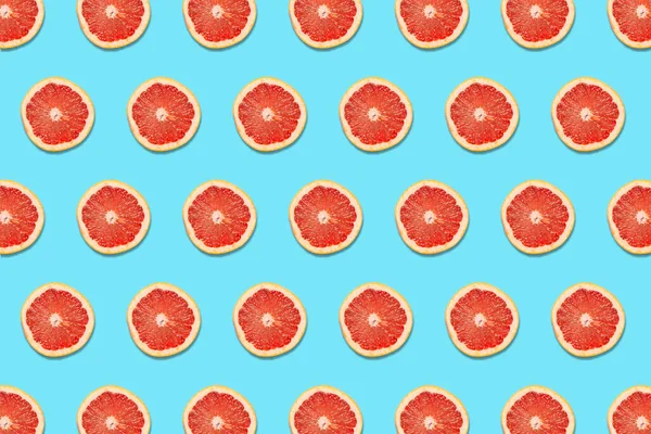 Grapefruit Slices Blue Background Pattern — Stockfoto