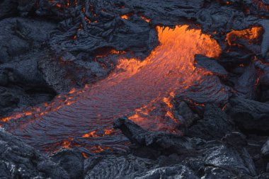 incandescent flowing volcanic lava in volcano clipart