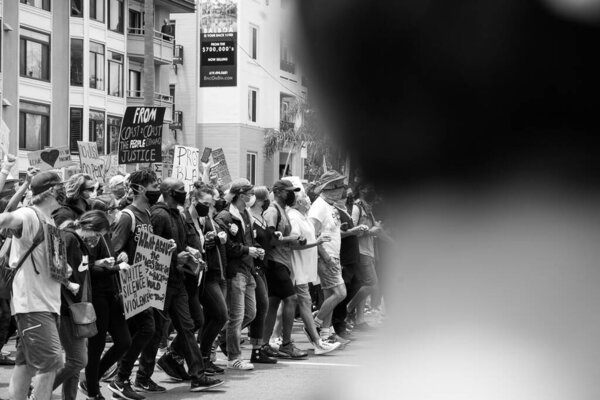 People walking at a Black Lives Matter march.