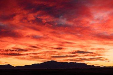 Fiery Red Sunset Over Pike's Peak Mountain in Colorado clipart