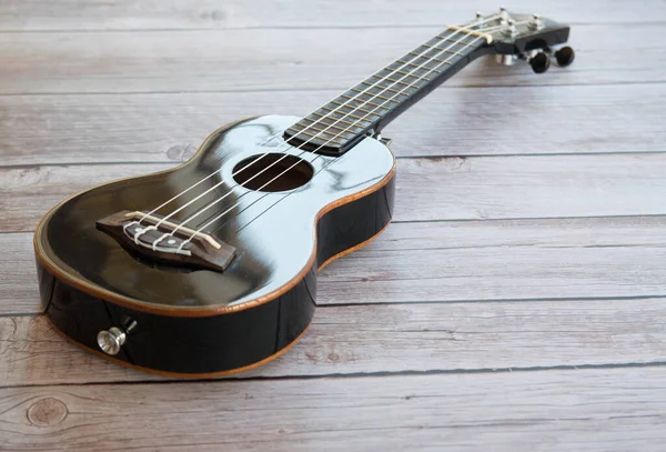 Black Ukulele Wooden Table — Stock Photo, Image