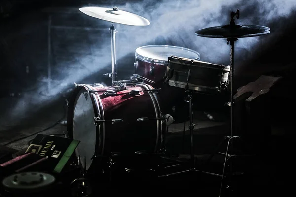 An Old Red Drum Kit in Smoky Room