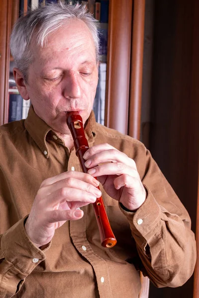 Elderly Man Playing Flute Home — Stock Photo, Image