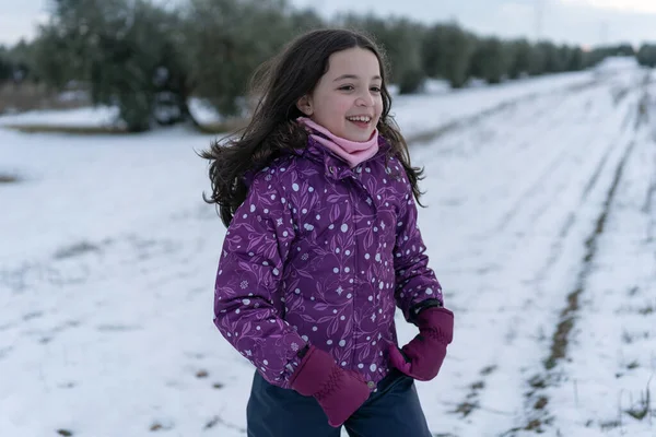 Girl Playing Happily Snow Field Olive Trees — Stock Photo, Image