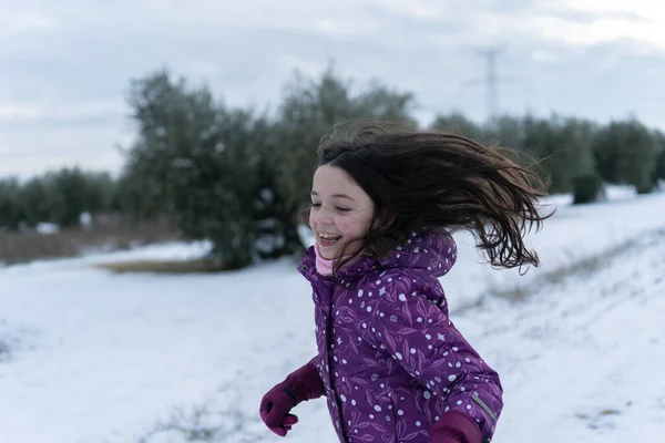 Girl Playing Happily Snow Field Olive Trees — Stock Photo, Image