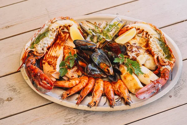 A delicious seafood barbecue with mussels, prawns and lobster