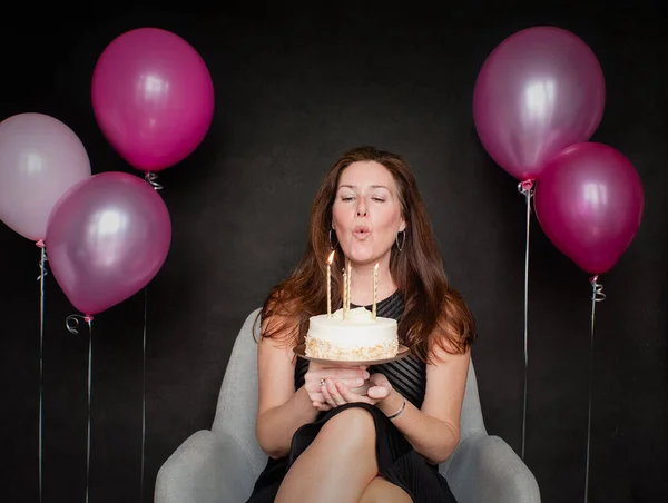 Pretty Woman Blowing Candles Out Birthday Cake Balloons — Stock Photo, Image