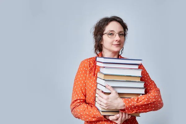 Middle Aged Woman Holds Stack Books Her Hands Monochrome Background — Foto de Stock