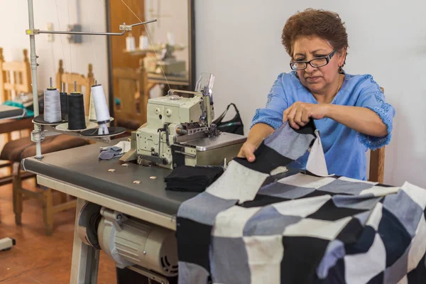 Mature Latin Seamstress Creating Patched Blanket Sewing Machine —  Fotos de Stock