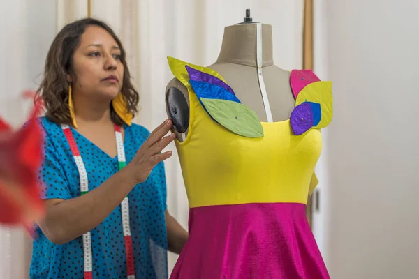Latin Fashion Designer Revising Colorful Dress Mannequin —  Fotos de Stock