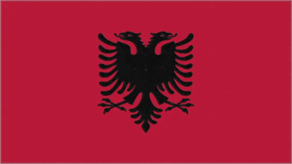 アルバニア刺繍旗 アルバニアの紋章が布を縫いつけた 紋章が刺繍されている 国のシンボルテキスタイルの背景 — ストック写真