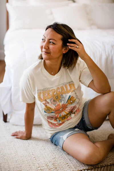 Chinese Woman Modeling Graphic Tee in Studio in San Diego